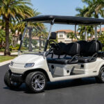 A modern 4-passenger electric golf cart in pearl white parked in a luxury neighborhood, representing the cost of new golf cart models in 2026.