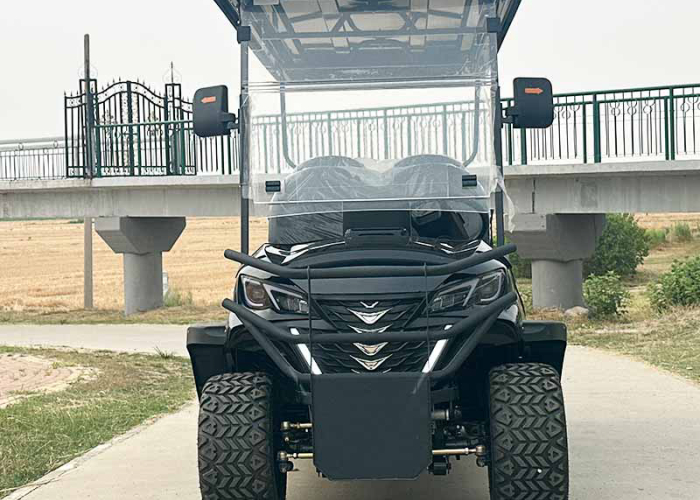electric golf cart near campground cabins and a pathway pickup point